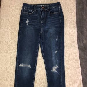 High rise distressed skinny jeans.